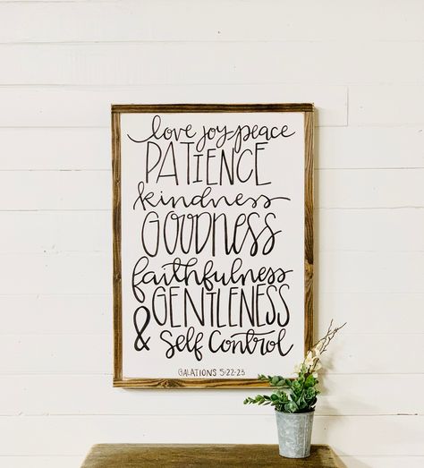 This wood sign measures 24 inches tall by 17 inches wide with a frame 1.5 inches thick. This fruit of the spirit sign is simple but beautiful.  This verse is from Galatians. If you love farmhouse decor you will definitely want to add this wood-framed sign to your collection. This sign makes a great housewarming gift or a nice gift for a friend that loves bible verse wall art.  I love Christian wall decor! Looks great in any room in the house! Purchase yours today! We are a family-owned business Wood Signs Bible Verse, Peace Wall Art, House Purchase, Scripture Wall Decor, Spirit Signs, Scripture Signs, Bible Verses About Love, Love Joy Peace, Prayer For Family