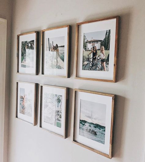 Minimal Family Photo Wall, Photo Frames Above Bed, Engagement Picture Wall Decor, Displaying Photographs On Wall Ideas, Living Room Photo Collage, Engagement Photo Display Home, Framed Engagement Photos On Wall, Wedding Wall Collage, Engagement Photo Wall Display