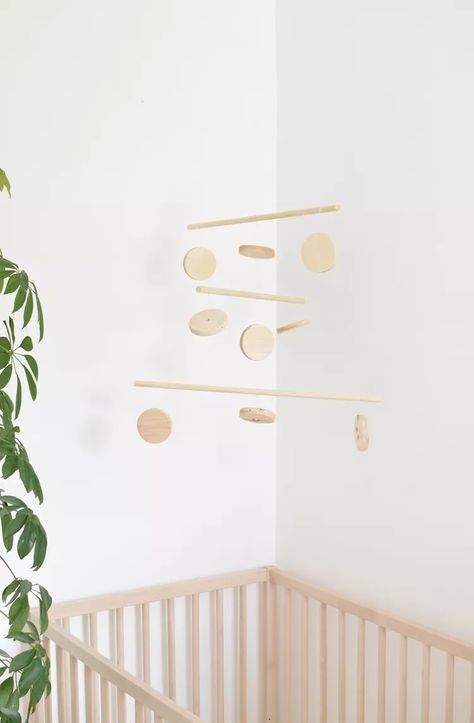 Update Your Baby's Nursery With This DIY Wooden Mobile | Hunker Twin Boys Room, Wooden Baby Mobile, Diy Nursery Mobile, Cottage Nursery, Wooden Mobile, Diy Baby Mobile, Diy Mobile, Unique Baby Shower Gifts, Nursery Mobile