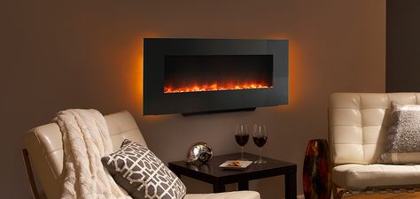 I love the idea of a wall mounted fireplace. It can look a bit too much like a TV but this one is long enough that it looks nice. I've also seen them change the color of the flames, so there can be blue or white ones instead. Hanging Fireplace, Best Electric Fireplace, Wall Mounted Fireplace, Wall Mount Fireplace, Mounted Fireplace, Small Fireplace, Wall Mount Electric Fireplace, Tv Bracket, Hearth And Home