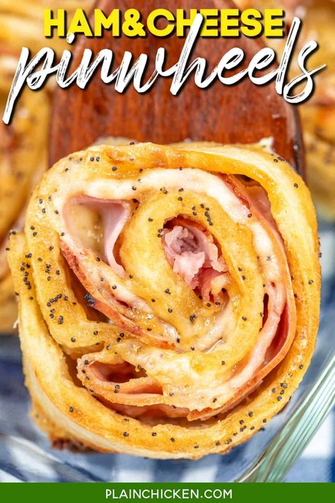 Hot Ham and Cheese Pinwheels Recipe - layers of honey mustard, deli ham and melty cheese baked in pizza dough and topped with a sweet and savory glaze made with butter, brown sugar, dijon mustard, Worcestershire sauce, and poppy seed. Whether you're serving them at a party, for an afternoon snack, or as an appetizer, they''ll have everyone reaching for seconds. Ham And Cheese Pinwheels Pizza Dough, Honey Baked Ham Appetizers, Hot Ham And Cheese Pinwheels, Plain Chicken Recipe, Hot Ham And Cheese, Cream Cheese Sausage Balls, Ham And Cheese Pinwheels, Pinwheels Recipe, Cheese Pinwheels