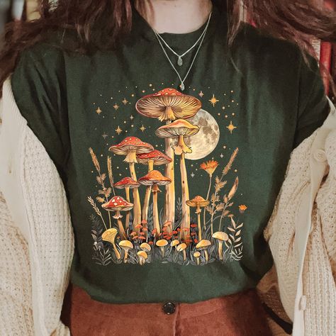 Cottagecore Mushroom Shirt, Nature Lover Shirt, Aesthetic T-Shirt, Goblincore Tee, Forestcore Top, Fairy Grunge Shirt Gift for her 📣 INFORMATION * All shirts are UNISEX * 100% Airlume combed and ringspun cotton (fiber content may vary for different colors) * Wash and dry normally (on cool for best results) 👕 SIZING * For an oversized fit, select two or three sizes up from your normal size * Model is wearing size L * Sizing runs true to size * Most women find their typical size works best, sinc Autumn Graphic Tees, Forestcore Fashion, Fairy Grunge Shirt, Masculine Clothing, Cottagecore Mushroom, Mushroom Shirt, Grunge Shirt, Shirt Aesthetic, Nature Shirts