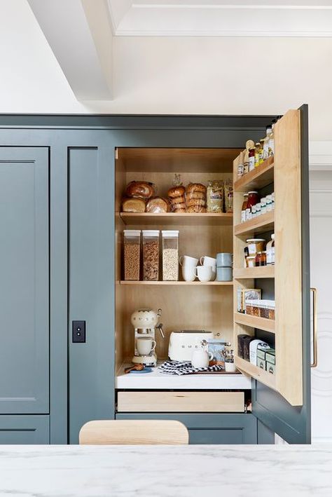 Hidden coffee station within a kitchen cabinet door makes for a cute and caffeinated use of kitchen space     Image via House Beautiful    #CenteredbyDesign #cabinetry #storageideas #storagesolutions #storagegoals #interiors #interiordesign #home #kitchendesign #coffeestation #kitcheninspo Modern Kitchen Canisters, Mountain Path, Kitchen Cabinet Organization Ideas, Coffee Bar Station, Coffee Area, Appliance Garage, Coffee Bar Ideas, Devol Kitchens, Home Coffee Stations