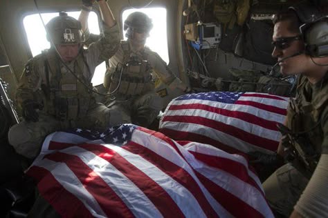 Troops ride in the back of a medevac helicopter escorting flag-draped U.S. soldiers who were killed by a roadside bomb attack in Afghanistan. (David Guttenfelder/Associated Press) Freedom Is Not Free, Patriotic Pictures, Some Gave All, Usa Pride, American Freedom, Military Love, Support Our Troops, Navy Seal, United States Military