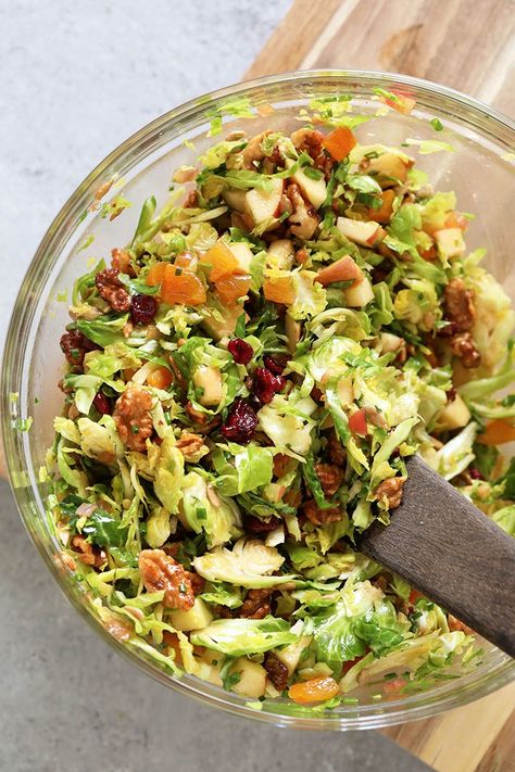 This Shaved Brussels Sprout Salad is fresh, flavorful and tossed with a healthy balsamic vinaigrette dressing. Dare we say the best of all worlds? From diced apples to dried apricots to candied almonds, and, of course, shaved brussels sprouts, this salad truly has it all! Enjoy. Honey Whipped Ricotta, Shaved Brussel Sprouts, Brussels Sprout Salad, Brussels Sprouts Salad, Whipped Ricotta, Vegan Queso, Balsamic Vinaigrette Dressing, Sprout Salad, Healthy Thanksgiving Recipes