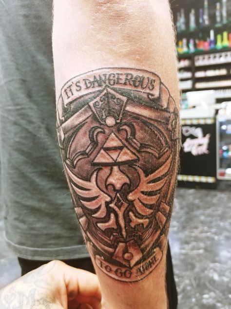 Hylian shield tattoo Hylian Shield Tattoo, Shield Tattoo, Hylian Shield, Geometric Tattoo, Tattoo Designs, Zelda, Tattoos