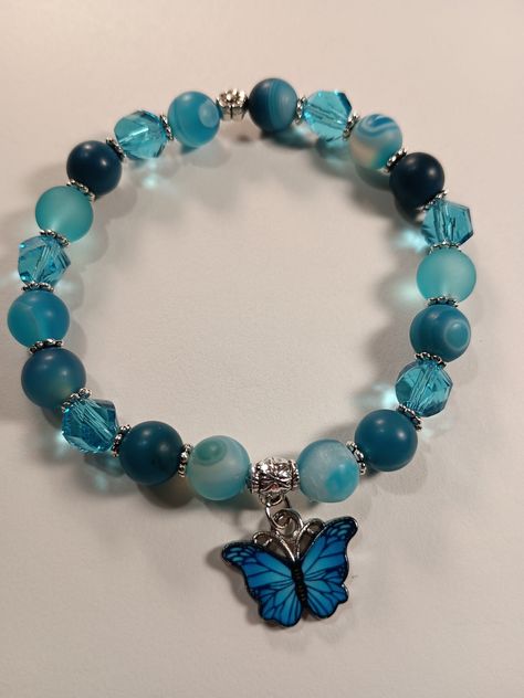 Stretch Bracelet w/Butterfly Charm beautiful matte blue striped agate and crystal beads. Color leans more turquoise then blue. Girly Bracelets, Butterfly Charm Bracelet, Expensive Jewelry Luxury, Wrist Jewelry, Diy Bracelet Designs, Sun City, Beads Bracelet Design, Jewelry Accessories Ideas, Pretty Bracelets