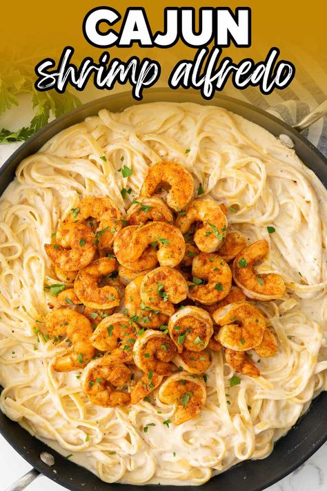 This easy Cajun Shrimp Alfredo is a spicy twist on classic Alfredo pasta.  Cajun seasoned shrimp, al dente fettuccine, and a creamy Alfredo sauce come together in less than 30 minutes for a mouthwatering meal that's sure to impress. Perfect for busy weeknights or special occasions, this easy recipe will become a new family favorite! Spicy Shrimp Alfredo, Cajun Salmon And Shrimp Alfredo, Easy Shrimp Alfredo With Jar Sauce, Cajun Shrimp Alfredo Recipe, Cajun Shrimp Alfredo Pasta, Cajun Shrimp Alfredo, Shrimp Fettuccine Recipes, Easy Cajun Shrimp, Shrimp Alfredo Pasta Recipes