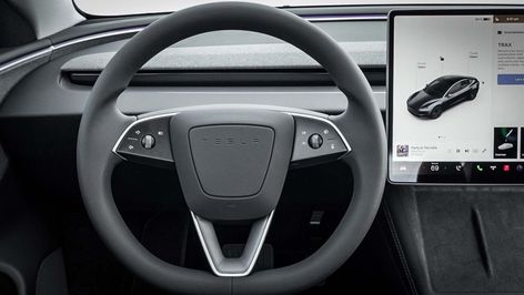 It's no yoke, the new Tesla Model 3's steering wheel and stalkless steering column add key functionality yet appear even more streamlined than before. Tesla Steering Wheel, New Tesla, Automotive News, Tesla Model 3, Steering Column, The Model, Tesla Model, Tesla, Steering Wheel