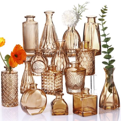 PRICES MAY VARY. Rich in Choices: you will receive a total of 16 pieces of amber glass bud vases with assorted embossed patterns, they are designed in 16 styles with different shapes equipped with vertical stripes and vintage Bohemian embossed designs and other figures Vintage and Elegant: these rustic wedding decorations are featured with embossed design on the amber glass surface, vintage and classic, full of romance and artistic feeling, which is attractive, elegant and charming enough to dec Table Flower Decor, Bud Vases Wedding, Glass Bud Vases, Glass Flower Vase, Table Flower, Clear Vases, Vase Small, Glass Flower Vases, Wedding Vases