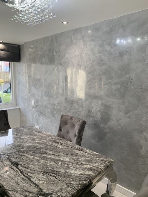 Dining room feature wall finished in grey marble high gloss venetian plaster. Concrete Wall Design, Dining Room Feature Wall, Room Feature Wall, Metallic Paint Walls, Tv Feature Wall, Fireplace Feature Wall, Staircase Wall Decor, Venetian Plaster Walls, Faux Walls