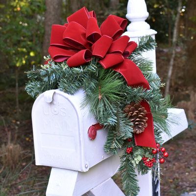 Our festive mailbox swag comes pre-decorated with a hand-tied velvet ribbon with a deeper holiday red color for lasting beauty. Decorate your mailbox with this lovely mailbox pine swag created with lush artificial soft flexible pine, red berries, and cones. Easily attaches to your mailbox with a wire. Our swag is shipped flat simply bend and attach it to the bottom of your mailbox with a chenille stem included. The Holiday Aisle® | The Holiday Aisle® Faux Pine Mailbox Swag w / Velvet Bow 12.0 H Christmas Mailbox Swag, Christmas Mailbox Decorations, Red Bow Christmas, Mailbox Swag, Pine Swag, Christmas Mailbox, Mailbox Decor, Door Swag, Floral Home Decor