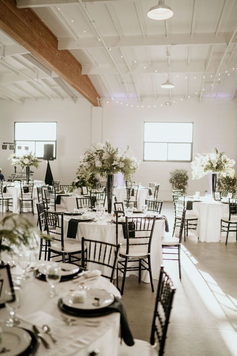 Ivory Tablecloth Wedding Black Chairs, Black And White Venue Wedding, Black Glam Wedding Decor, Mixed Wedding Centerpieces, Black White Reception Decor, Wedding Centerpiece With Cylinder Vases, Black And White September Wedding, White Table Cloth Black Chairs Wedding, Elegant Black White And Gold Wedding