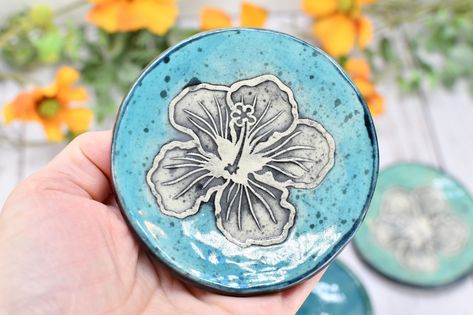 My original tropical hibiscus flower design is imprinted into wet clay on each of my small, handmade stoneware dishes. Use as a trinket bowl for earrings and jewelry, tea bag rest, pill dish, or as a mini spoon rest for coffee and tea lovers. Also makes a great drip tray for placing under box wine holder spouts. Each is handmade and is functional ceramic pottery, and is the perfect, unique gift for Christmas, Mother's Day, anniversary, Valentine's Day, birthday, engagement, and more! Once the cl Hibiscus Flower Design, Box Wine, Wood Gift Box, 13 Hours, Tropical Hibiscus, Stoneware Dishes, Pottery Gifts, Olive Oil Bottles, Jewelry Trinket