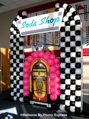 juke box decoration | Soda Shop with Juke Box creates a focal point for the lobby of an ... 50s Party Backdrop, Soda Shop Party Decor, 1950s Diy Decor, Grease Party Decorations Diy, 50s Theme Balloon Arch, Sock Hop Balloon Arch, Sock Hop Activities, 50s Theme Decorations, 50s Balloon Decor