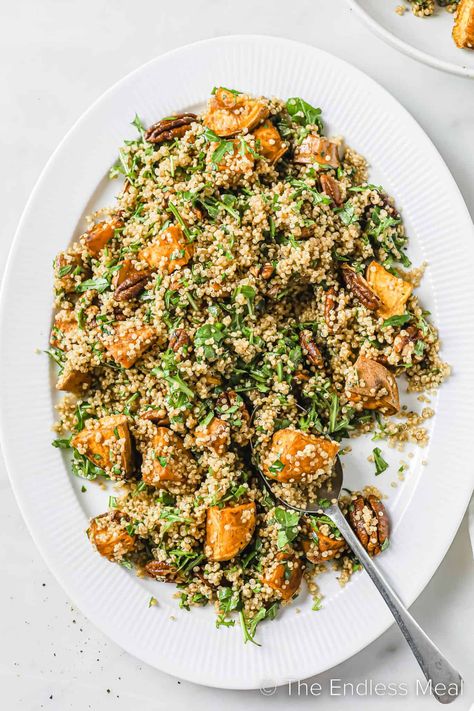 Here's an autumn quinoa salad that's delicious, filling, and perfectly seasonal. It's tender baked sweet potatoes, fluffy quinoa, pecans, and greens tossed with an easy maple dijon dressing. It's a quick and healthy side dish or light main, and it's ready in just 35 minutes! #theendlessmeal #quinoasalad #autumnsalad #fallsalad #fall #autumn #quinoa #salad Fall Quinoa Recipes, Autumn Quinoa, Fall Quinoa Salad, Maple Dijon Dressing, Fluffy Quinoa, Waitrose Food, Lentils And Quinoa, Dijon Dressing, Baked Sweet Potatoes