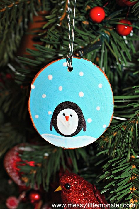 How to make fingerprint penguin wood slice Christmas ornaments. An easy kid - made Christmas ornament DIY for toddlers and preschoolers that doubles up as a keepsake. Great for a penguin, snow or winter project. Sibling Christmas Ornaments Diy, Fingerprint Penguin, Diy For Toddlers, Fingerprint Ornaments, Fingerprint Ornament, Kids Make Christmas Ornaments, Ornaments For Kids To Make, Wood Slice Christmas Ornaments, Diy Christmas Photo