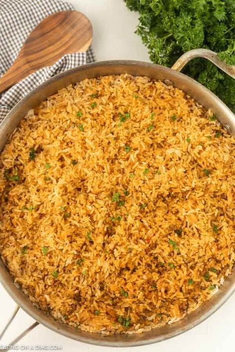 Texas Roadhouse Seasoned Rice in a skillet. Instant Pot Texas Roadhouse Rice, Outback Seasoned Rice, Texas Road House Rice, Texas Roadhouse Rice Recipe, Texas Roadhouse Rice, Roadhouse Rice, Texas Roadhouse Seasoned Rice, Seasoned Rice Recipe, Skillet Rice