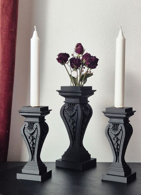 This unique set contains a gothic style vase and one or two fitting candleholders, crafted through 3D printing. If you're into all things Gothic - from the architecture to the lifestyle - this set is gonna be your new favorite thing to show off in your crypt. Vase: Width 40 mm/1.57 in Depth 40 mm/1.57 in Height 170 mm/6.69 in Weight 141 g/4.97 oz Please note, this vase is designed for decorative purposes only and is not suitable for holding water! Candle holder: Width 65 mm/2.56 in Depth 65 mm/2 Goth Style Living Room, Drip Candle Holder, Bedroom Decor Gothic, Gothic Utensils, Romantic Gothic Decor, Classy Goth Home Decor, Gothic Desk Decor, Gothic Apartment Aesthetic, Antique Gothic Decor