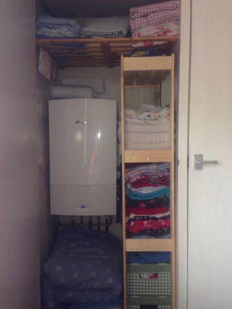 A good way to maximise storage space in a small airing cupboard. Boiler In Wardrobe, Airing Cupboard Storage With Boiler, Boiler Cupboard Storage, Airing Cupboard Ideas With Boiler, Boiler Cupboard Ideas Storage, Airing Cupboard Storage, Shoe Storage Cupboard, Airing Cupboard, Kitchen Cupboard Organization