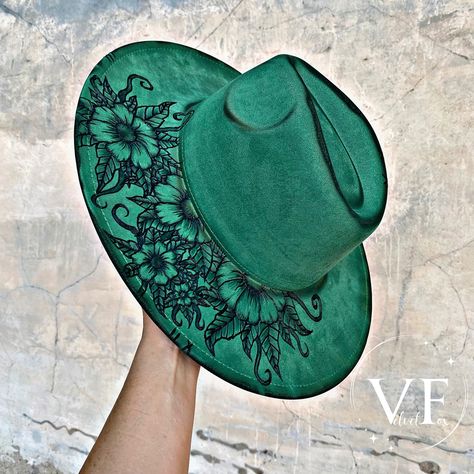 Shop this cute hat and others are available to ship today! Shop on Etsy or our website today! #hatshop #hatstore #hat #hats #tattooed #handburned #burnedhats #etched #art #handcrafted #handmade #custom #artist #western #floral #greenhat #cute #chic #fashion #style #boho #bohogypsy #gypsy #concert #festival Felt Hat Designs, Emerald Flowers, Honeymoon Photoshoot, Burned Hats, Hat Burning, Felt Design, Hand Burn, Wedding Honeymoon, Felt Cowboy Hats