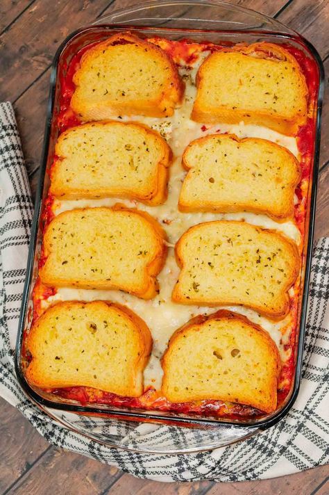 Dump and Bake Meatball Casserole is a hearty casserole made with frozen Italian meatballs, marinara sauce, diced tomatoes, ricotta and mozzarella and topped with frozen Texas toast garlic bread. Dump And Bake Meatball Casserole, Toast Garlic Bread, Frozen Italian Meatballs, Meatballs Marinara, Texas Toast Garlic Bread, Oven Baked Meatballs, Frozen Fruit Recipes, Italian Casserole, Ricotta Meatballs