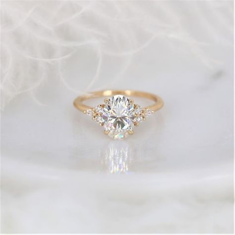 Love and Promise Jewelers on Instagram: "The Thea you know and love but with an elongated oval center stone! Would you love to receive our 10x7mm Petite Thea as your engagement ring?" 3 Stone Engagement Ring, Pretty Engagement Rings, Cute Engagement Rings, Future Engagement Rings, 3 Stone Engagement Rings, Forever One Moissanite, Cluster Engagement Ring, Dream Engagement, Dream Engagement Rings