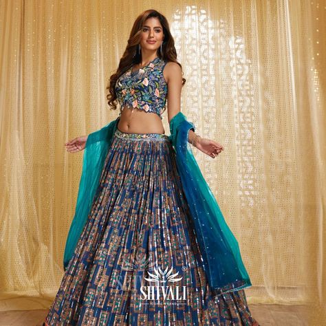 A blue printed lehenga embellished with intricate details and graced by the beautiful drape of a monochromatic dupatta. Captivating contrasts at their finest! 🌿 https://www.instagram.com/p/CwnKxHnhZuw/?igshid=MzRlODBiNWFlZA== . . . #Shivali #ethnicwear #ShivaliIconicTrends #ShivaliFashion #ShivaliFashionAhmedabad #ShivaliAhmedabad #newlaunch #indiailove #WeddingCollection #WeddingSeason #Style #Trending #TrendingReels #MadeInIndia #traditional #ethnic #newlaunch #newcollection #summercollect Printed Lehenga, Beautiful Drapes, New Launch, Blue Print, Intricate Details, Wedding Season, Shiva, Lehenga, India