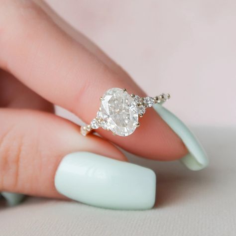 2.90 Ct Oval Cut Moissanite Engagement Ring, Oval Cut Ring, Elongated Oval, Moissanite Engagement Ring, Ice Crushed Oval ✥ 𝐌𝐚𝐢𝐧 𝐒𝐭𝐨𝐧𝐞 𝐃𝐞𝐭𝐚𝐢𝐥𝐬 ↣ Shape: Oval Cut ↣ Type: Moissanite ↣ Weight: 2.90 Ct (App.) (10.5x7mm) ↣ Side Stone: Moissanite ↣ Color: Colorless ↣ Clarity: VVS ↣ Making Process: Handmade - Crafted by our experienced team ✥ 𝐑𝐢𝐧𝐠 𝐃𝐞𝐭𝐚𝐢𝐥𝐬 ↣ Band Width: 1.8 mm (± 0.10) [Customization Possible] ↣ Metal Purity: Solid Gold (10KT, 14KT, 18KT); Silver (925 Sterling) Diamond Cluster Engagement Ring, Traditional Diamond, Oval Moissanite, Moissanite Diamond Rings, Pave Engagement Ring, Cluster Engagement Ring, Moissanite Wedding Bands, Pretty Rings, Engagement Ring Wedding Band