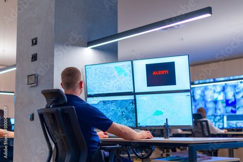 Stock Image: Male computer operator monitoring from a security ( computer, logistic ) center. Computer Operator, Design Display, Display Ideas, Adobe Stock, Stock Images, Computer, Stock Photos, Graphic Design, Design