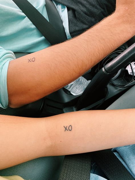 #coupletattoos #xoxo #xoxotattoo #matchingtattoos Tattoos With Your Boyfriend, Dainty Tattoos For Couples, Small Boyfriend Tattoos, Small Simple Matching Tattoos Couples, Tattoo Ideas For Boyfriend And Girlfriend, Matching Tattoo Boyfriend Girlfriend, Simple Cousin Tattoos, Matching Small Tattoos Couples, Small Simple Couple Tattoos