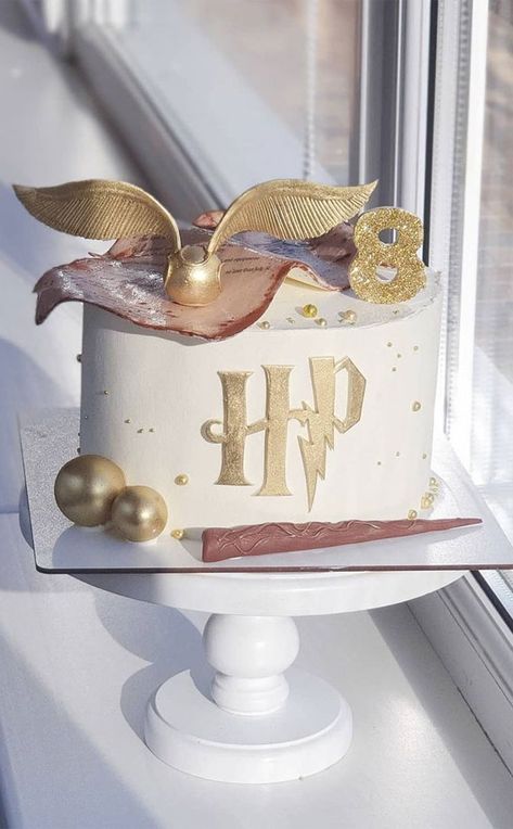 29. Harry Potter White Cake with Golden Snitch birthday is always a delightful event. A birthday celebration is never complete without a nice cake.... Snitch Birthday Cake, White And Gold Harry Potter Party, Harry Potter Snitch Cake, Golden Snitch Cake, Harry Potter 21st Birthday Cake, White Harry Potter Cake, Golden Snitch Birthday Cake, Harry Potter Small Cake, Simple Harry Potter Cake Ideas