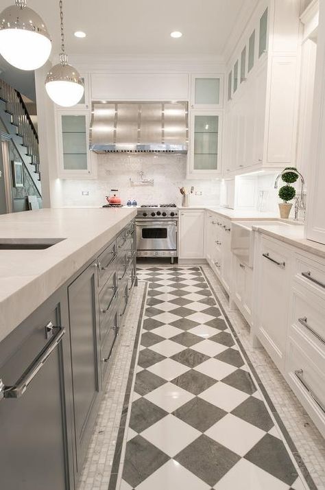 Checkered floors in a contemporary kitchen add charm surrounded by small marble floor tiles, gray and white cabinets and polished nickel pulls. Checkerboard Floor Kitchen, Checkered Floor Kitchen, Grey Marble Kitchen, Best Flooring For Kitchen, Marble Backsplash Kitchen, Gray Island, Marble Kitchen Island, Grey Kitchen Island, Marble Countertops Kitchen