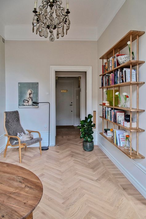 This 875-Square-Foot Stockholm Apartment Offers a Cosmopolitan Alternative to Hygge | Architectural Digest Narrow Bookshelf, Stockholm Apartment, Thonet Chair, Dream Sofas, Old Apartments, Custom Benches, Large Dining Table, Local Furniture, Yellow Kitchen