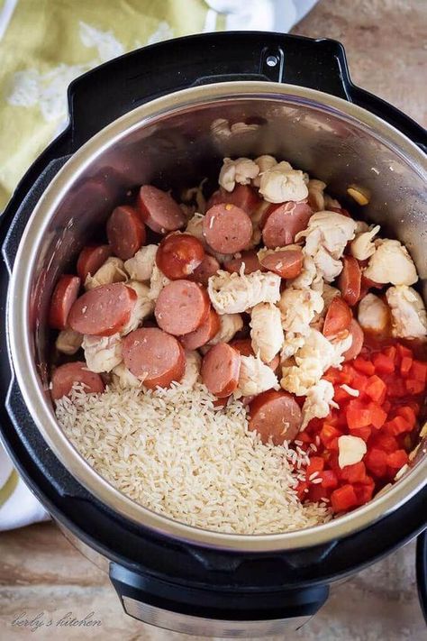 Ariel view of an open Instant Pot with cooked chicken and sausage, tomatoes, and rice for jambalaya. Sausage And Chicken Jambalaya, Tomatoes And Rice, Chicken Jambalaya, Chicken And Sausage, Electric Pressure Cooker Recipes, Pot Recipes Easy, Cooked Rice, Instant Pot Recipes Chicken, Creole Seasoning