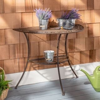 Transform any outdoor space into an entertaining hub for family and friends with this stylish end table. Designed with beautiful scrollwork in a classic hue, its two tiers of durable iron storage are perfect for snacks, drinks or games. - Store outdoor furniture indoors or cover well when not in use. Remove wooden furniture from standing water. Dust regularly with small brush or vacuum. Spills should be taken care of immediately before they harden or stain with a slightly dampened sponge. Do not Half Moon Console Table, Outdoor End Tables, Iron Storage, Outdoor Side Tables, Outdoor Furniture Design, Outdoor Tables, Patio Table, Metal Table, Accent Furniture