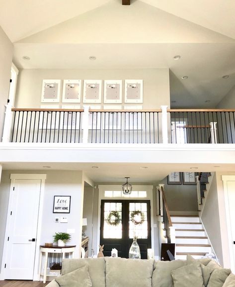 Two story living room view looking up. Second Story Overlooking Living Room, Living Room Open To Upstairs, Modern Farmhouse Open Living Room, Two Story House Plans With Vaulted Living Room, Master Bath Ideas Small Space, Upstairs Open To Below, Railing Overlooking Living Room, Great Room Makeover, Upstairs Looking Down Into Living Room