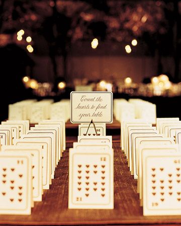 The number of hears on tented playing cards designates table assignments. The guests' names are on the other side. Creative Seating Cards, Funny Wedding Cards, Wedding Aesthetics, Funny Wedding Invitations, Lowcountry Wedding, Seating Cards, Wedding Tables, Martha Stewart Weddings, Card Wedding