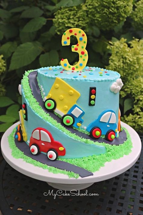 Car and Truck Cake Tutorial! This sweet spiral cake design is a free cake video tutorial by My Cake School! #carcake #truckcake #carandtruckcake #trafficcake… Cars Cake Design, Cake Designs For Boy, Rodjendanske Torte, Truck Birthday Cakes, Cake Designs For Kids, Baby Boy Birthday Cake, Cars Birthday Cake, Truck Cake, Fondant Cake Designs