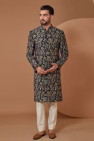 Blue velvet sherwani with multi-colored floral and thread embroidery. Components: 1 Pattern: Embroidered Type Of Work: Floral, Thread Neckline: Mandarin collar Sleeve Type: Full Fabric: Velvet Color: Blue Other Details:  Closure: Front buttons Note: Pant worn by the model is not for sale. Occasion: Wedding,Groom - Aza Fashions Velvet Sherwani, Sherwani Groom, Sherwani For Men, Embroidered Velvet, Indian Groom, Groom Outfit, Velvet Color, Thread Embroidery, Sherwani