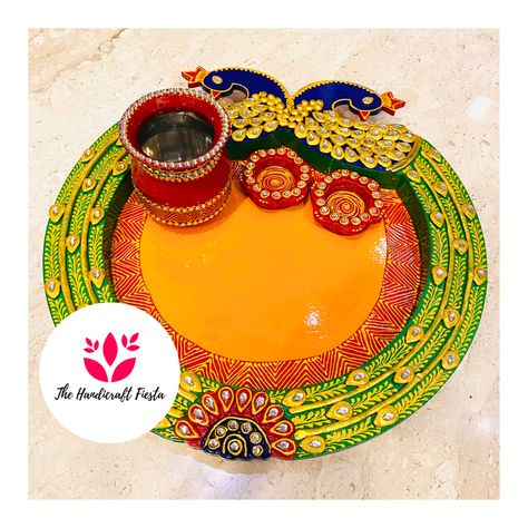 Wooden Pooja Thaali 🌸 Size: 14*15 Color : Multicolor, Material : Wooden Hand-crafted by craftsmen & artisans of India Package Included: 1 Handcrafted Work Pooja Thali, 2 katories 1 lota Presented to you by on the occasion of diwali, raksha bandhan & other festive season. Also use as a best wedding & occasinal return gifts. Care Instruction - Don't wash, use dry cotton cloth to remove dirt Description The Product Has Been Crafted In Wooden. It Is Considered To Be The Most Sacred Pooja Material Diy Pooja Thali, Raksha Bandhan Thali Decoration, Indian Handicrafts Decor, Indian Decor Diy, Diy Jewelry Tray, Arti Thali Decoration, Arti Thali, Aarti Thali, Crafts Storage