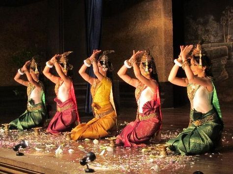 Robam Tep Apsara (របាំទេពអប្សរា, lit., Dance of the Apsara Divinities) is the title of a Khmer classical dance created by the Royal Ballet of Cambodia in the mid-20th century under the patronage of Queen Sisowath Kossamak. The Apsara is played by a woman, sewn into tight-fitting traditional dress,[1] whose graceful, sinuous gestures are codified to narrate classical myths or religious stories Apsara Dance, Trip The Light Fantastic, The Royal Ballet, Classical Dance, Royal Ballet, Siem Reap, Ancient Temples, Dance Performance, Traditional Dress