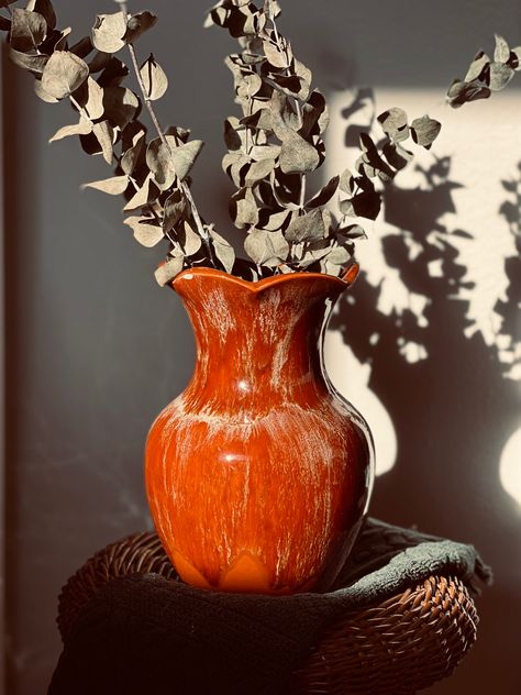 red pottery vase with scalloped mouth. Styled with eucalyptus bunch. Burnt Orange Vase, Earthy Vintage, Orange Plates, Orange Vase, Vintage Pottery Vases, Burlington Ontario, Clay Vase, Wine Glass Set, Black Accessories