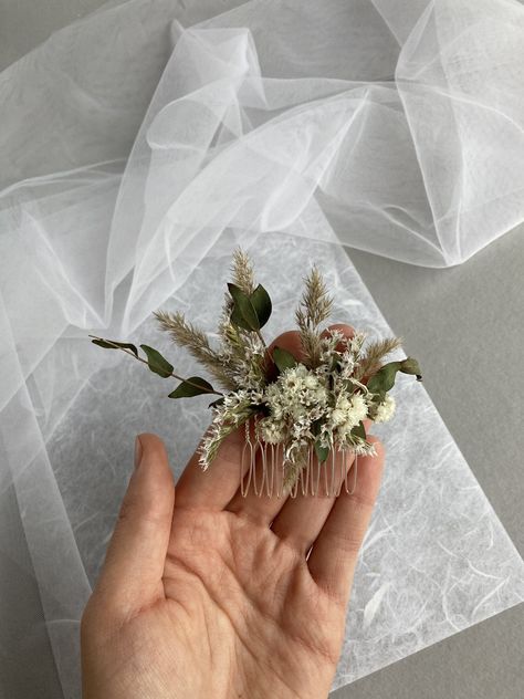 * This delicate hair comb made with Eucalyptus Natural dried different flowers. *Complement most wedding hairstyles. It is the perfect bridal hair vine for that woman who wants to simply sparkle on her wedding day. Dimensions: 5 cm x 12 cm IMPORTANT DELIVERY INFORMATION: All parcels to United States will be delivered via USPS - 7-10 business days, If you bought 35 $ or 40 € with a coupon in our store, we send byregular mail and delivery time to USA is 2-6 weeks. To Europe 1-3 weeks . If you want Dried Flower Comb Wedding Hair, Flower Comb Wedding Hair, Boho Wedding Hair Pieces, Dried Flower Hair Comb, Diy Bridesmaid Hair, Floral Hair Piece Wedding, Dried Flower Wedding, Bridal Hair Pieces Flower, Flower Wedding Hair