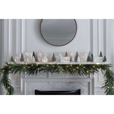 Faux Christmas Mantle, Ceramic Houses Christmas Decor, Minimal Christmas Mantel Decor, Christmas Decor Ideas Silver And White, White Ceramic Houses Christmas Mantle, Christmas Village Entry Table, How To Display Christmas Village, White Village Christmas Houses, Simple Mantle Christmas Decor