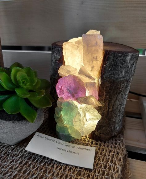 Rose quartz, amethyst and Green Fluorite energy bursting out of a natural stump. Beautiful. 💯 Indie Decor, Forest Life, Crystal Lamps, Rock Gifts, Quartz Rock, Crystal Cave, Green Fluorite, Crystal Magic, Crystal Crafts