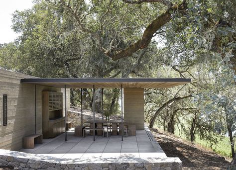 Carefully selected materials help the building feel as if it grew from the land. Warner and McCabe specified durable, environmentally sensitive finishes that echo the existing winery (which WWA designed in 2002). A crushed stone path links the pavilions; the floor is made from tinted concrete; a fly-ash concrete wall custom colored to match the soil blocks the wind; the casework is composed of sinker cypress wood reclaimed from Louisiana swamps; the retaining walls are made from locally quar... Forest Pavilion, Tinted Concrete, Sinker Cypress, Soil Blocks, Forest Homes, California Architecture, Cypress Wood, Steel Columns, Wood Cladding