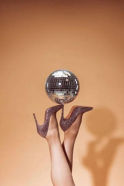 Cropped image of woman holding shiny disco ball on high heels at party on beige — effulgence, female - Stock Photo | #228179878 Photo Cropping, Crop Image, Female Images, Disco Ball, Professional Photographer, Stock Images Free, Hold On, High Heels, Stock Images