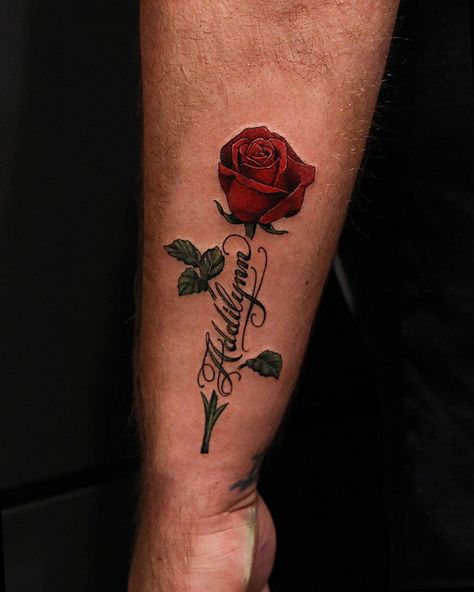 Hunter Schuon on Instagram: “Rose and some script from last night! Always enjoy tattooing flowers! To schedule a tattoo appointment please call or email…” Roses Around Name Tattoo, Red Roses Arm Tattoo, Red Rose Arm Tattoo, Roses With Names Tattoos, Red Rose Tattoo Men, Name With Rose Tattoo, Red Roses Tattoo, Rose Stem Tattoo, Ruby Tattoo