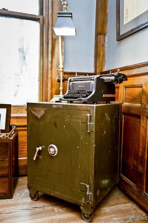 In the study of the Summit Avenue mansion, expert rehabber Nicole Curtis decorates the study with a repurposed old safe that she found in the basement and a typewrite that she got at an estate sale. Nicole Curtis Rehab Addict, Rehab Addict, Antique Safe, Vintage Hutch, 1920s Interior Design, Nicole Curtis, Hiding Ugly, Hgtv Star, Vault Doors